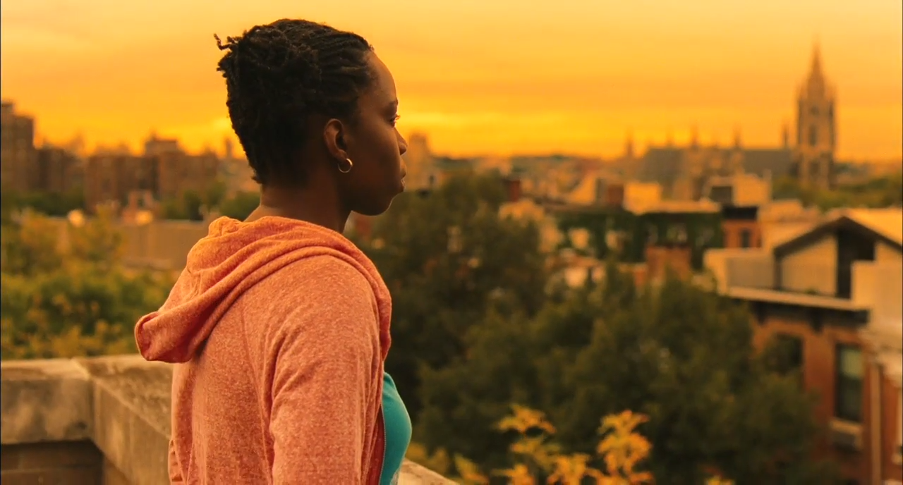 Adepero Oduye in Pariah. She overlooks a city at sunset.
