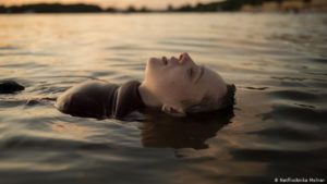 Esty laying in the lake