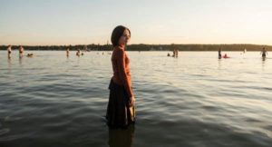 Esty standing in the lake