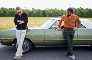 Frank and Wally standing near the car