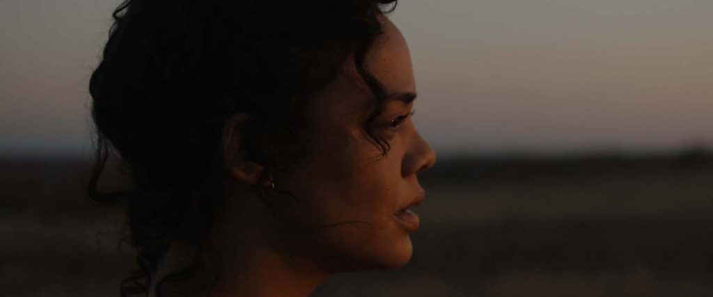 Ollie (Tessa Thompson) looks into the distance