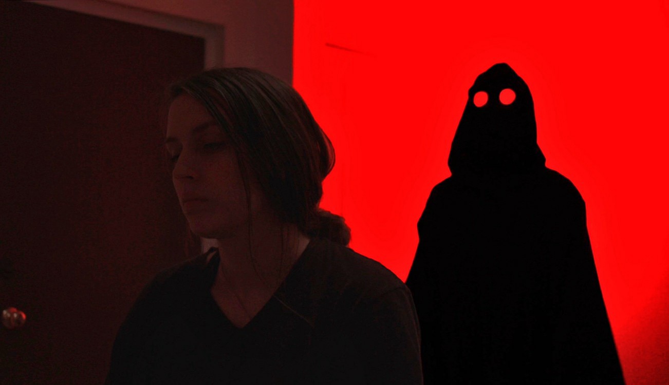 Short Film "Sleep No More" Cover Image of a dark figure looming behind a young woman