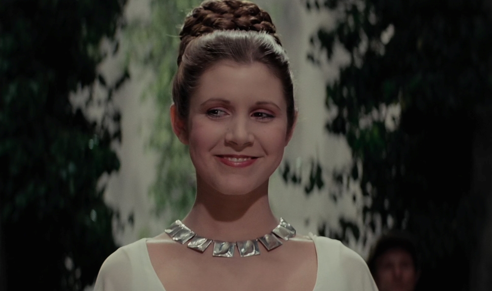 Leia smiles at the medal ceremony in "A New Hope"