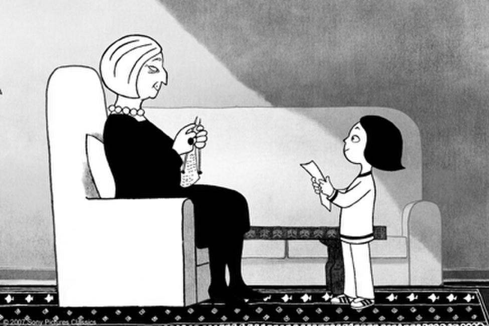 Young Marji approaches her grandmother, holding a piece of paper. Her grandmother sits in an armchair, knitting and smiling fondly at Marji.