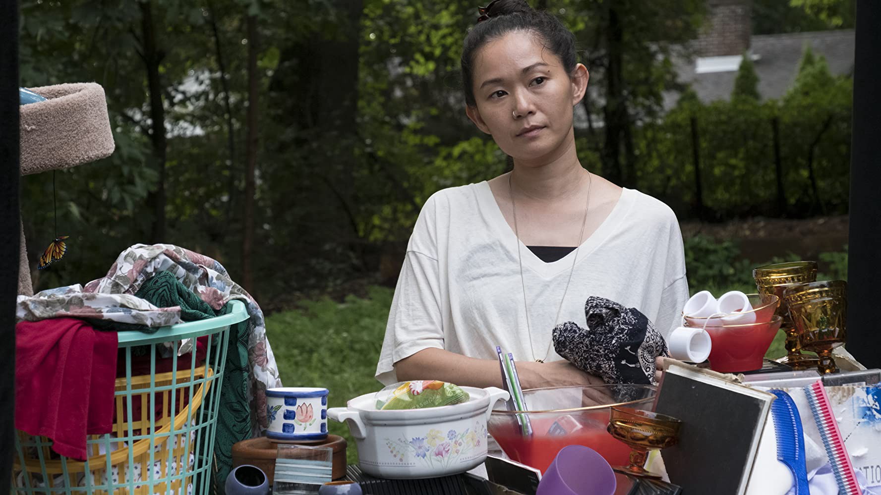 Kathy sits in front of a pile of April's belongings