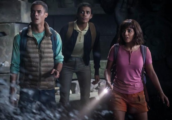Diego (Jeff Wahlberg), Sammy (Madeleine Madden), and Dora (Isabela Merced) exploring a cavern