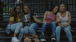 4 girls hanging out on the bleachers