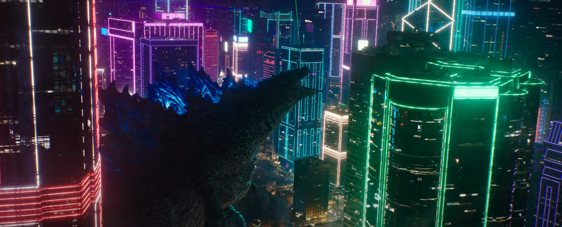 Godzilla walks through Hong Kong's neon-lit buildings and roars