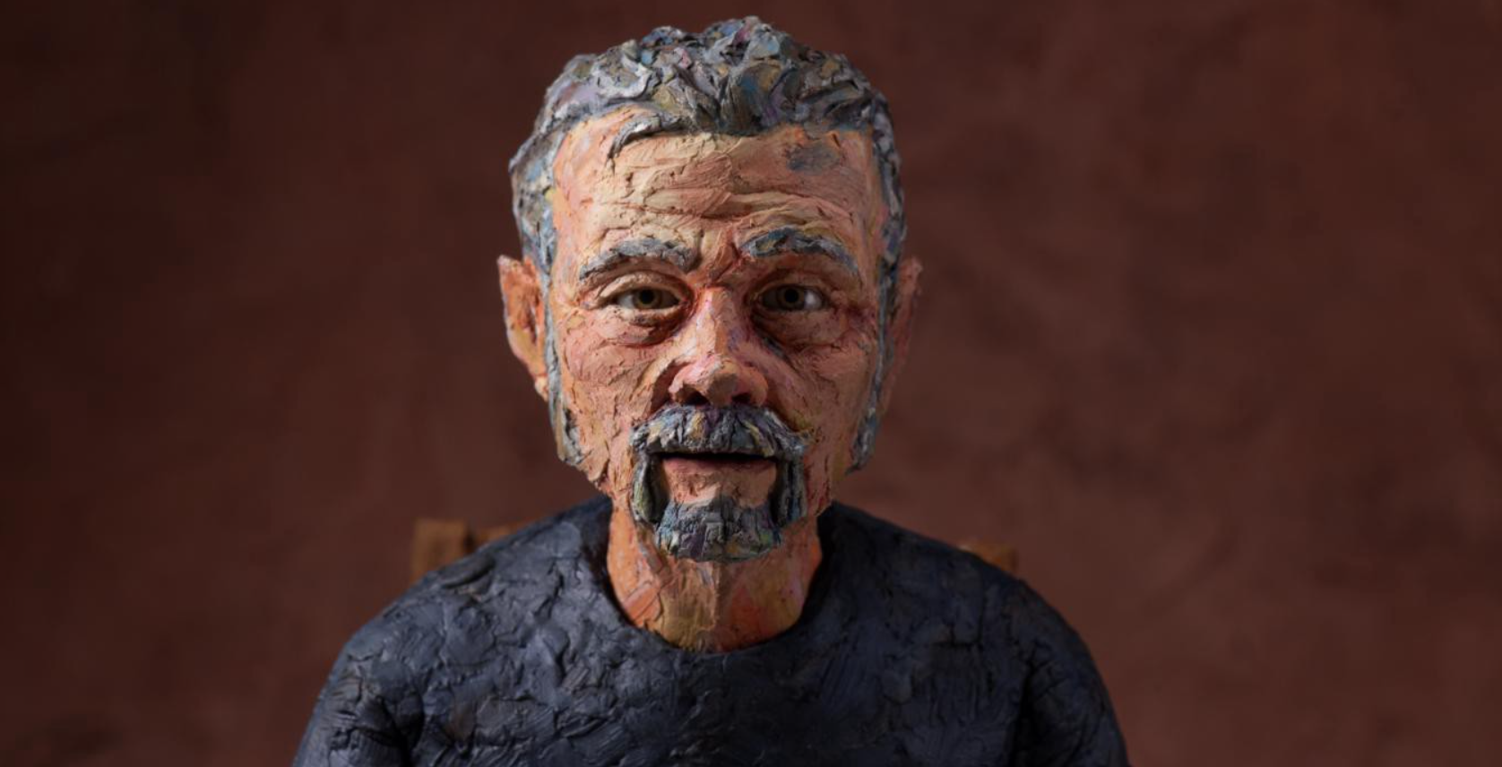 A claymation rendering of an aging white man.