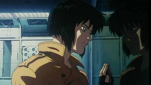 Image from Japanese Anime "Ghost in the Shell" of a character looking at their reflection in a window with their hand on the glass