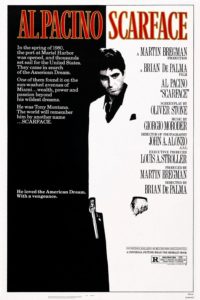Poster for "Scarface." Al Pacino stands in the center, and the image is black and white with bright red text.