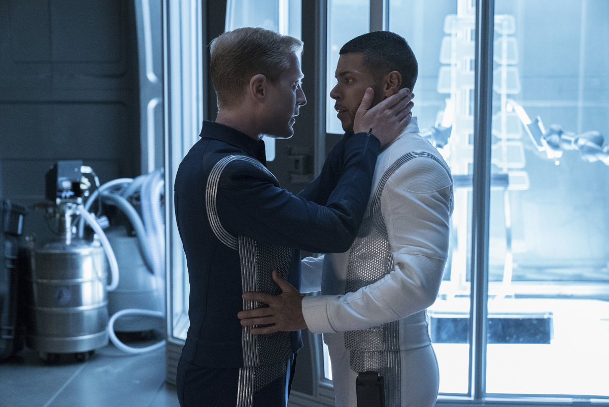 Samets and Culber embrace in the laboratory of a starship.