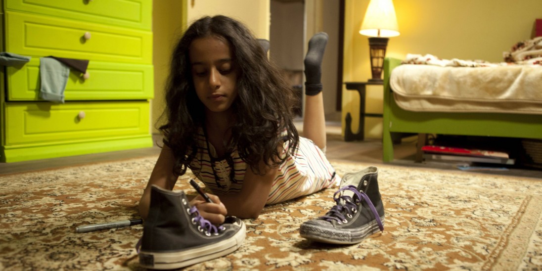 Waheed Girl Wadjda coloring her sneakers black