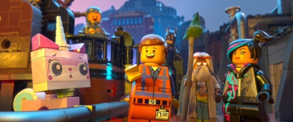 A still from the movie showing Emmet surrounded by his crew of Master Builders