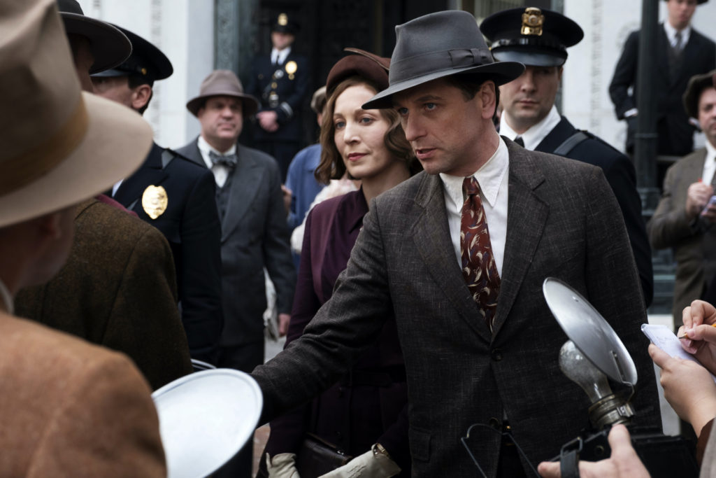 Perry (Matthew Rhys) and Della (Juliet Rylance) speak to the press.