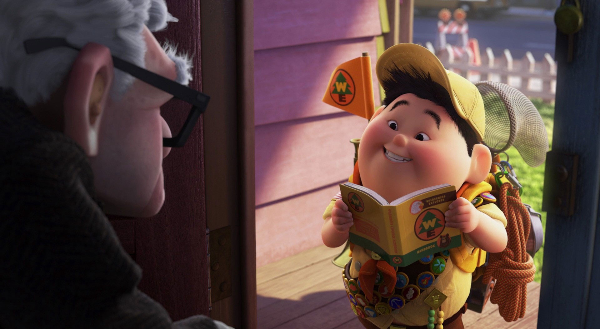 Russell, a young boy, stands in Carl's doorstep. He wears a yellow Boy Scouts-style uniform and reads aloud from a book.