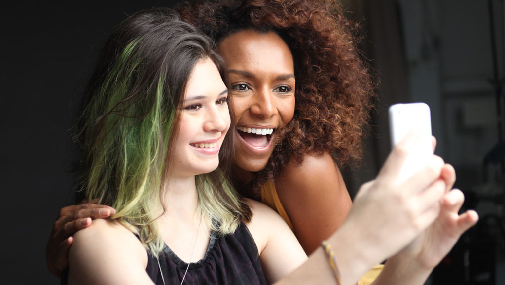 Trans activists Nicole Maines and Janet Mock take a selfie together