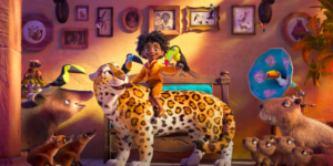 An image from the Encanto trailer of an Afro-Latino Madrigal son with animals