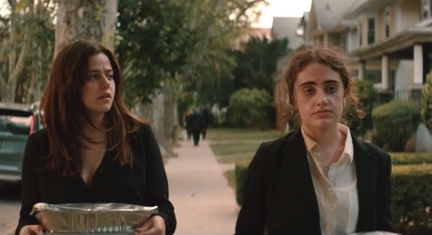 Maya (pictured to the left) helping Danielle (pictured to the right) carry trays of food to an elderly attendant’s car. It’s within this scene Danielle opens up to Maya on her reasons for being a sugar baby.