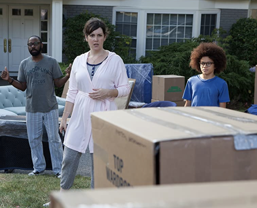 The Burns family reacting to their “Little Boxes” of possessions being left out on there lawn by movers.