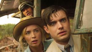 A still from "Jungle Cruise" of McGregor, Lily, and Frank looking out the boat, terrified