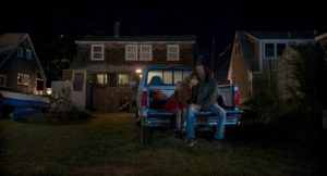 A still from "CODA" of Frank and Ruby sitting on his truck outside