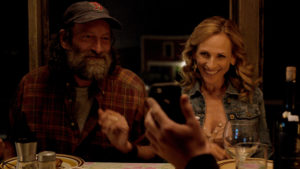 A still from "CODA" of Frank and Jackie at the dinner table