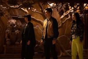 A still from 'Shang-Chi' of Shang-Chi, Xialing, and Katy learning about Ta Lo from Wenwu