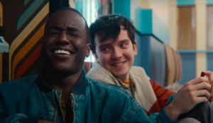 A still from Season 3 of Sex Education of Otis and Eric laughing 