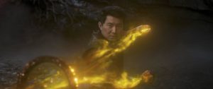 A still from 'Shang-Chi' of Shang-Chi using the Ten Rings against Wenwu