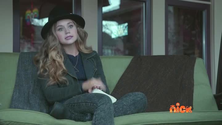 This image is of Brec Bassinger, who plays a girl who is a vampire expert, reading a book