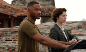 Will Smith and Mary Elizabeth Winstead outdoors, looking into the distance.