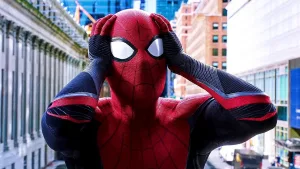 A still from "Spiderman: Far From Home" of Spider-Man with his hands on his head in distress