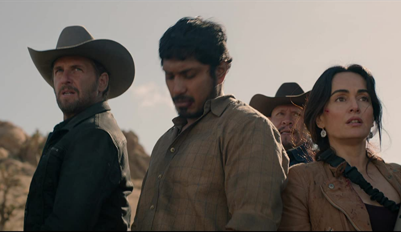 Dylan, Juan, and Adela out in the desert.