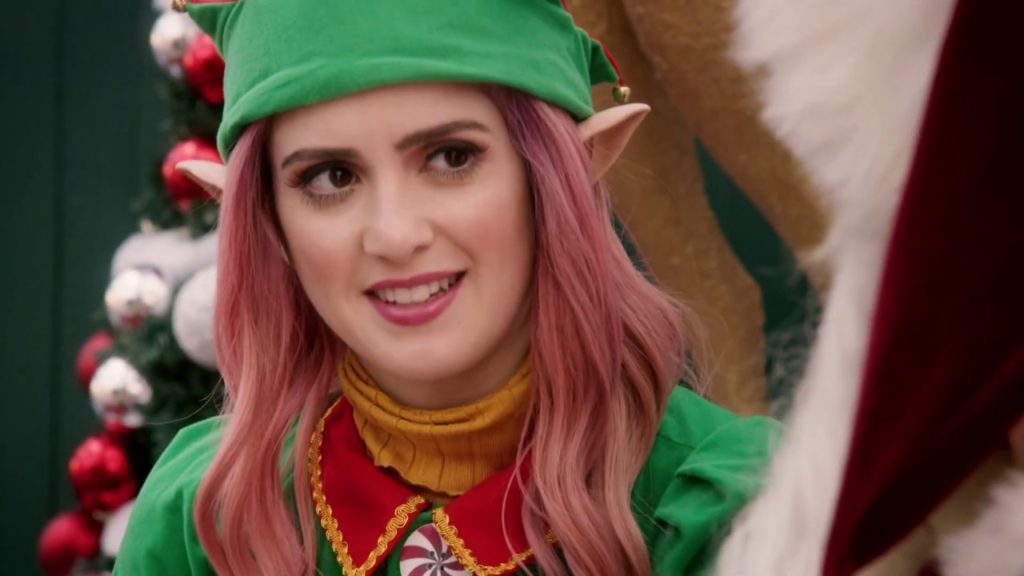 This image consists of Kat dressed as one of Santa's elves