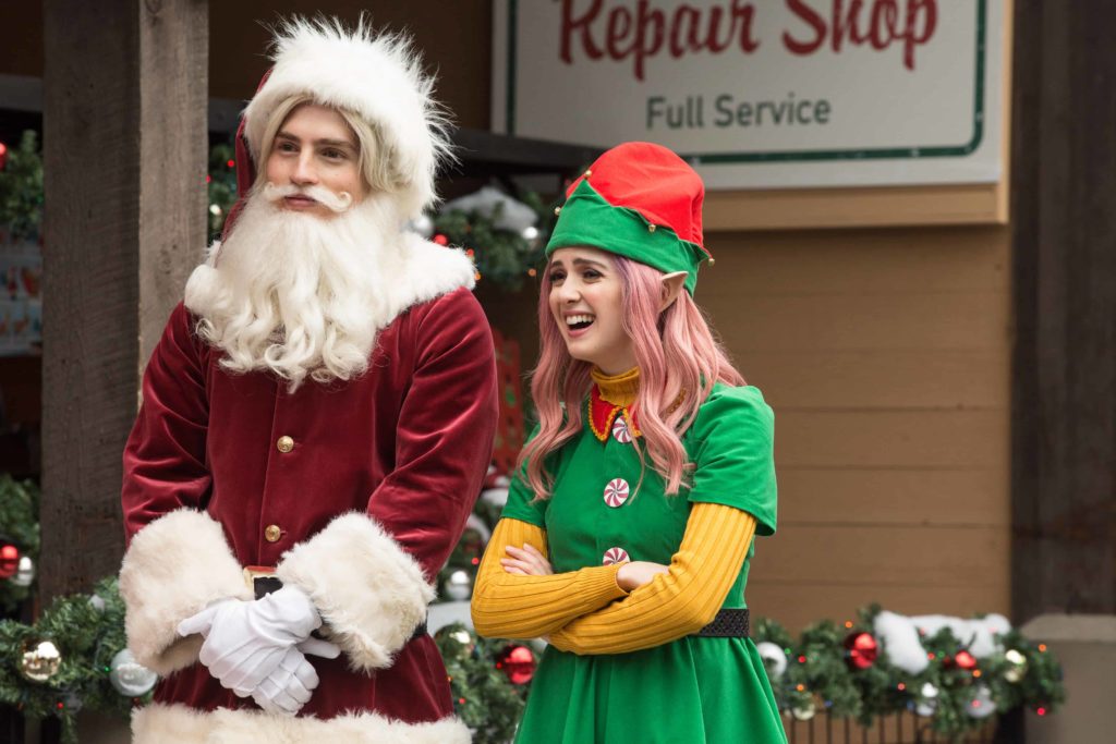 This image consists of Nick and Kat as Santa and an elf, respectively