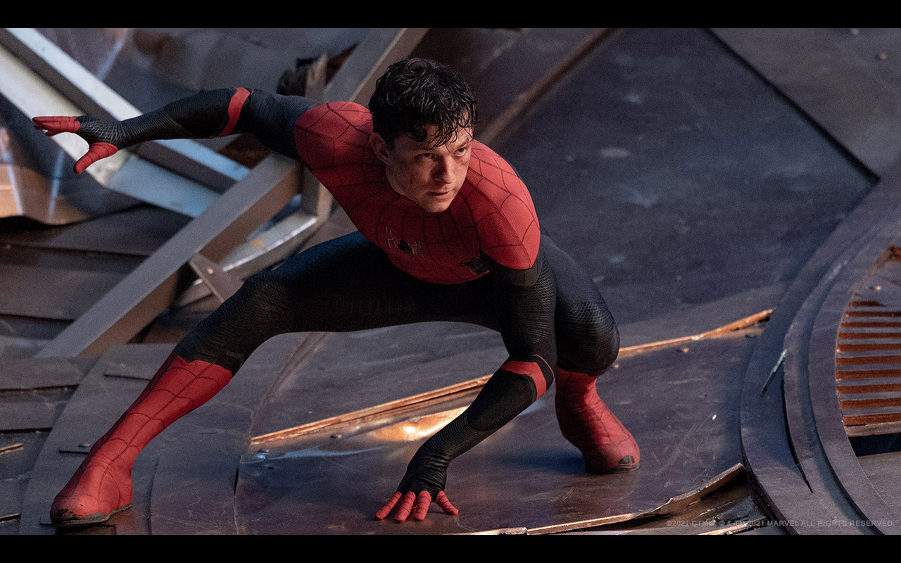 A still from Spider-Man: No Way Home of Peter Parker in the Spider-Man suit posing angrily
