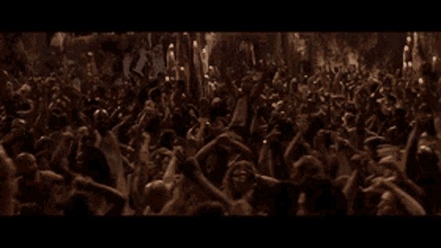 Scene from Matrix: Reloaded of everyone dancing in a dim light cave trans allegories