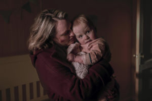 June holds her baby Nicole, still from The Handmaid's Tale