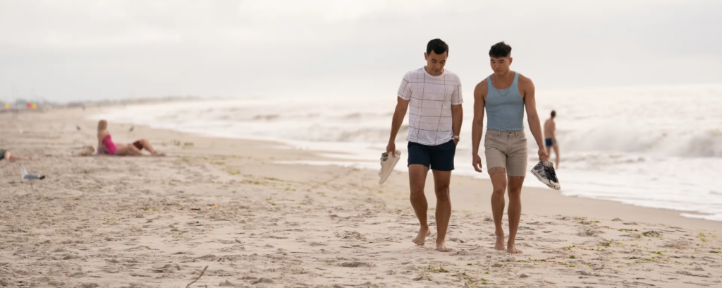 Noah and Will take a walk along the beach.