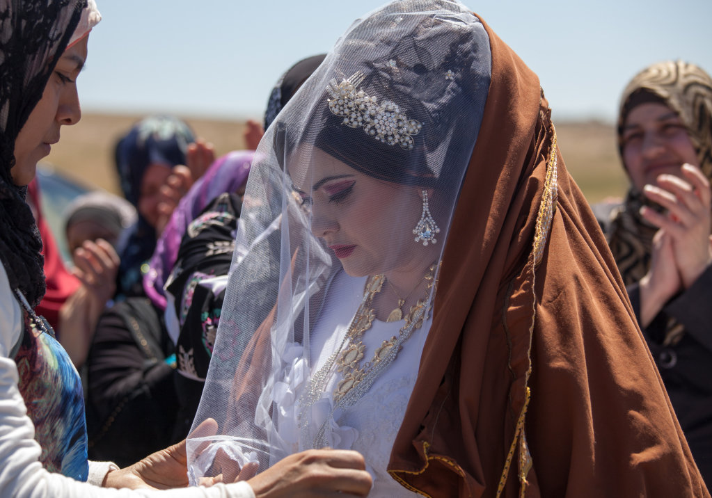 Jalila greets her husband's new bride