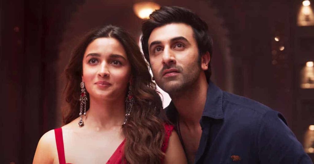 Shiva played by Ranbir Kapoor is standing close to Isha played by Alia Bhatt as they look forward