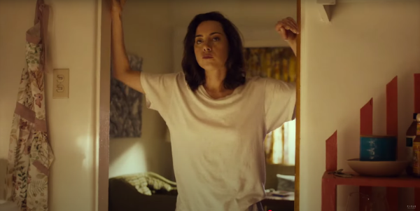 Aubrey Plaza as MG, standing in the doorway of Honey's bedroom