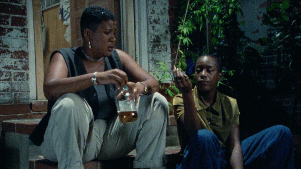Tamara and Cheryl drinking and smoking on the stoop